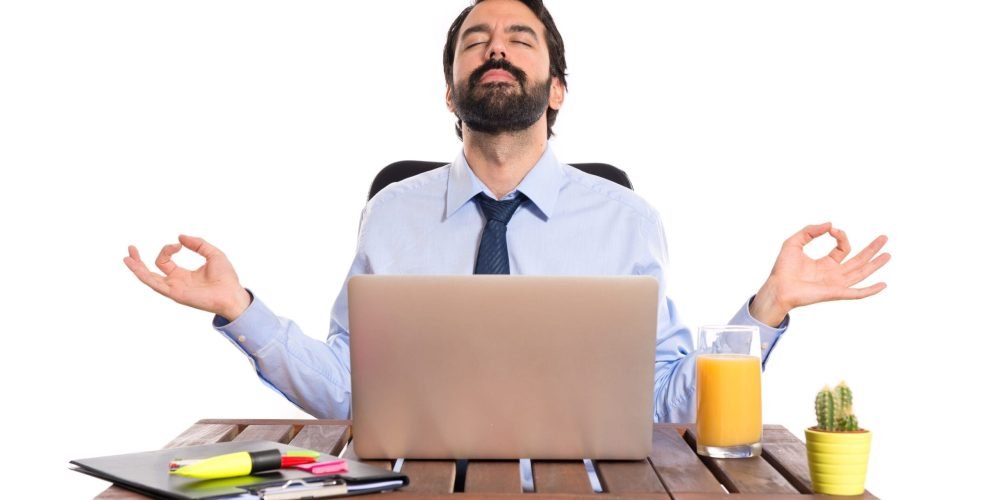 Businessman in his office  in zen position