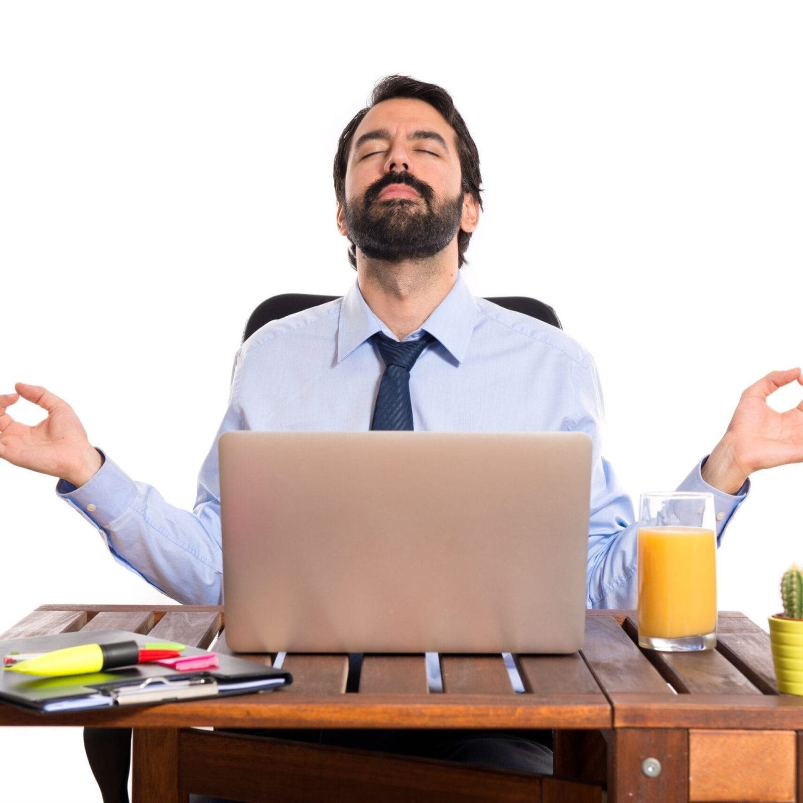 Businessman in his office in zen position Businessman in his office in zen position